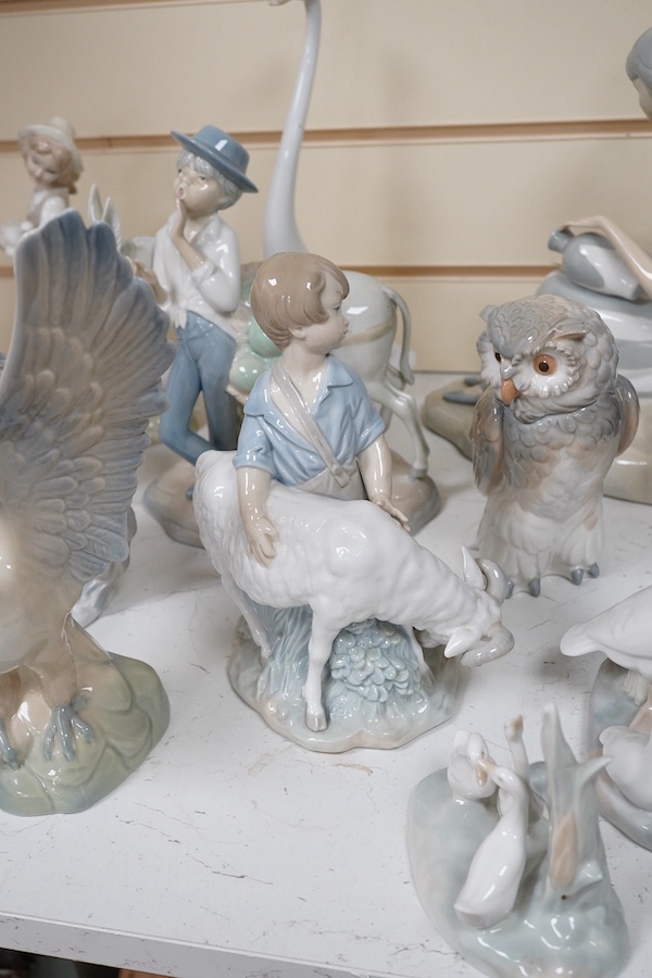 A quantity of Lladro style and Nao figures (12). Condition - good